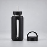Black 800 ml glass bottle with silicone sleeve, wide straw and spare loop lid.