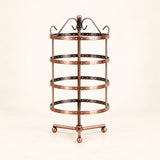 Empty bronze four-tier jewelry stand with bronze three-foot tripod with ball-ended feet.