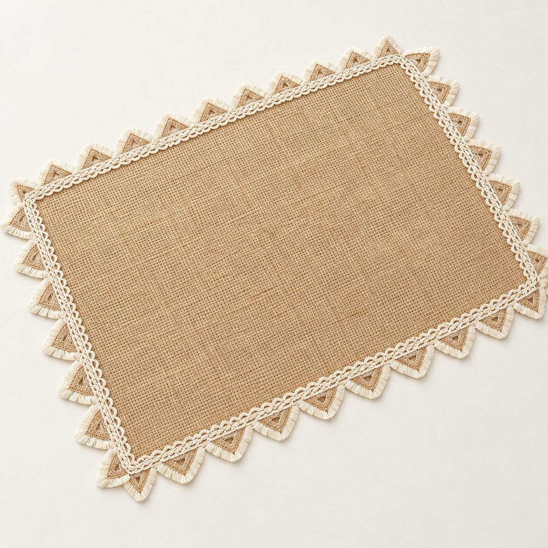 One tan placemat with cream triangle trim, 30 x 45 cm.