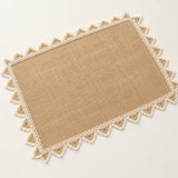 One tan placemat with cream triangle trim, 30 x 45 cm.