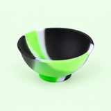 Green, black and white mini silicone bowl, single empty piece in studio.