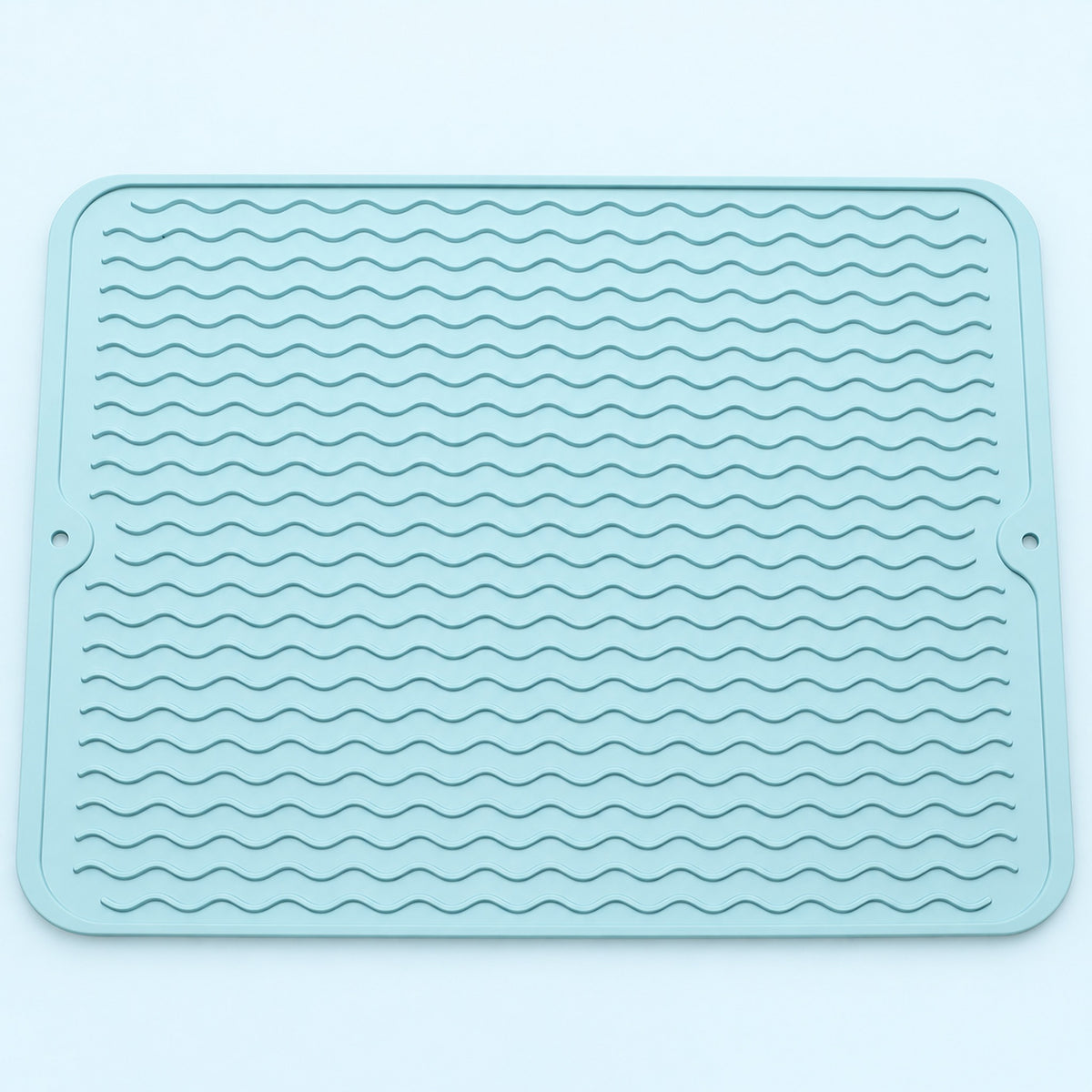 Light blue wavy-ridge silicone mat with two hanging holes.