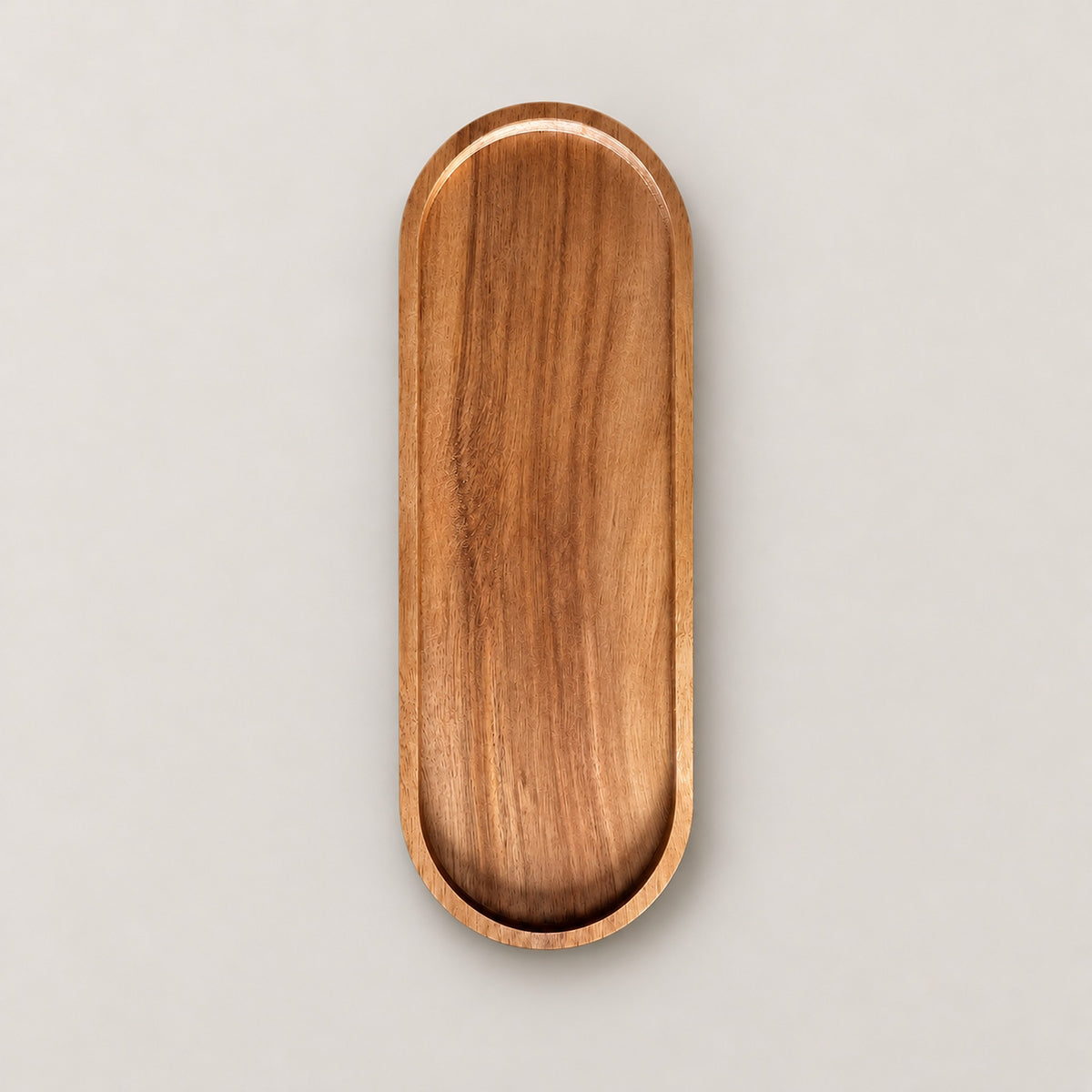 One large, 29 x 10.5 cm oval wood tray on a pale studio background.