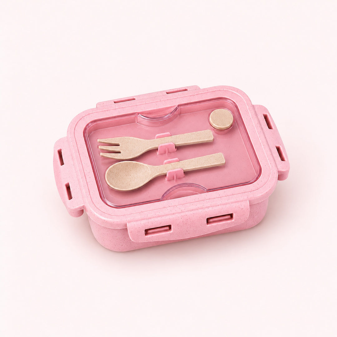 One assembled soft pink lunch box with fork and spoon stored beneath clear lid.