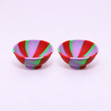 Two red purple and green swirl silicone mini bowls, open tops and pedestal bases.
