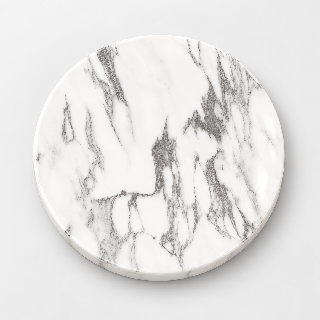 A round white marble coaster with elegant gray veining, shown from a top-down perspective on a light gray background.