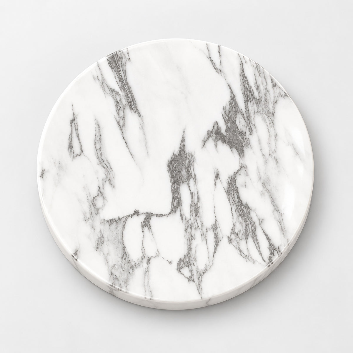 A round white marble coaster with elegant gray veining, shown from a top-down perspective on a light gray background.