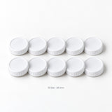 Set of ten white 86 mm ribbed plastic mason jar lids.