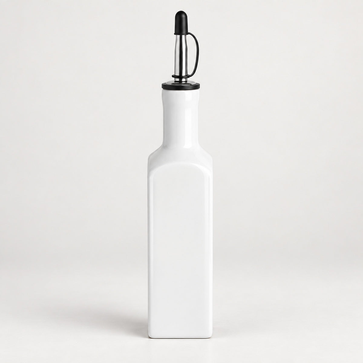 A white ceramic bottle with a black metal and plastic pour spout, shown against a clean white background.