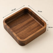 A square wooden tray with rounded corners and depth measurements overlaid, showing 14 cm by 14 cm by 3.8 cm dimensions on a light beige background.
