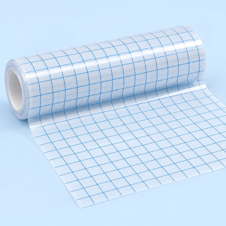 A roll of clear adhesive grid tape with blue lines, partially unrolled on a light blue background.