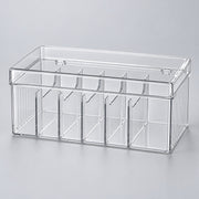 A clear plastic rectangular organizer box with multiple vertical compartments, shown on a light gray background.