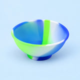 Blue, green and white mini silicone bowl, single empty piece in studio.