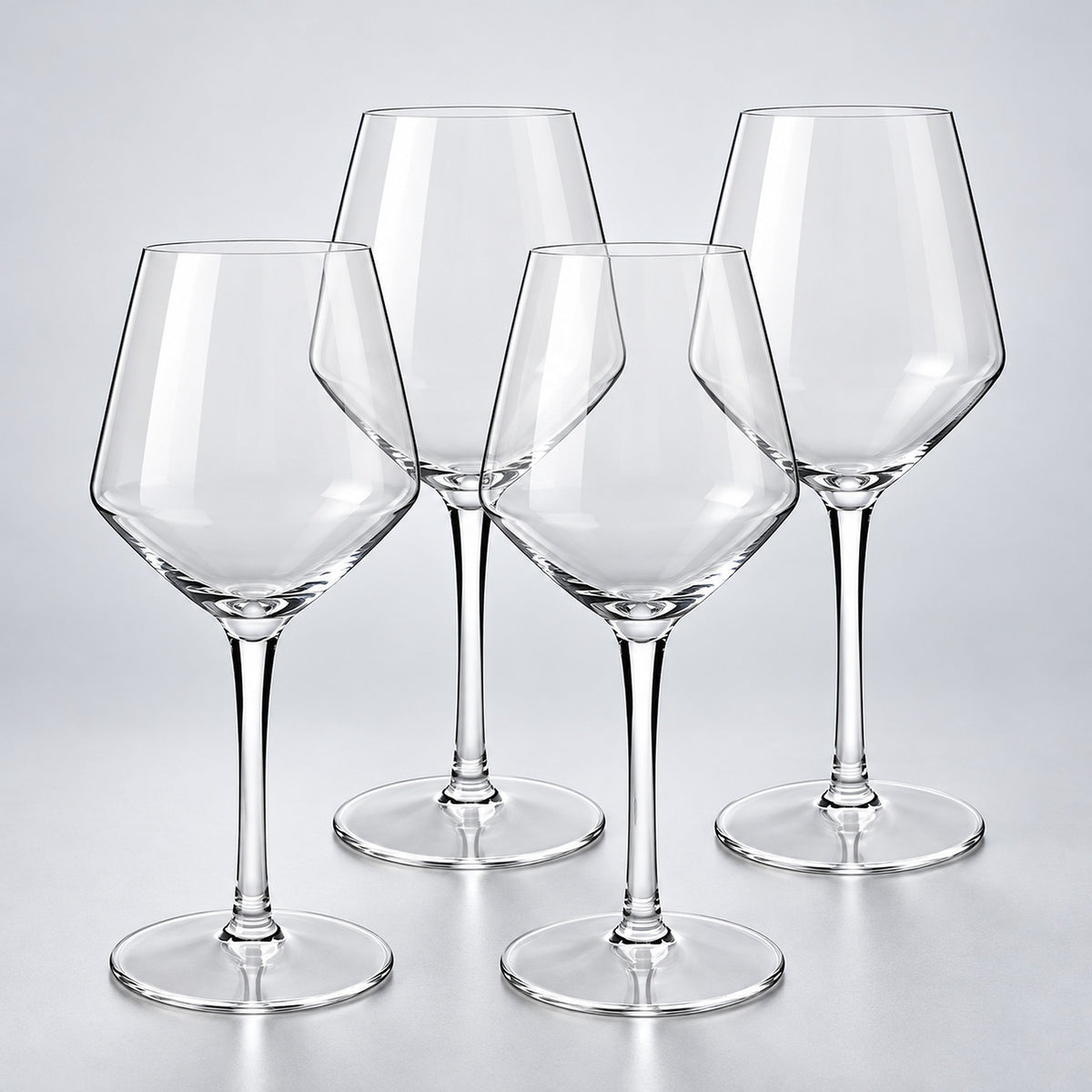 Bordeaux set of 4: 4 empty clear stemmed Tritan wine cups on a pale gray studio background.