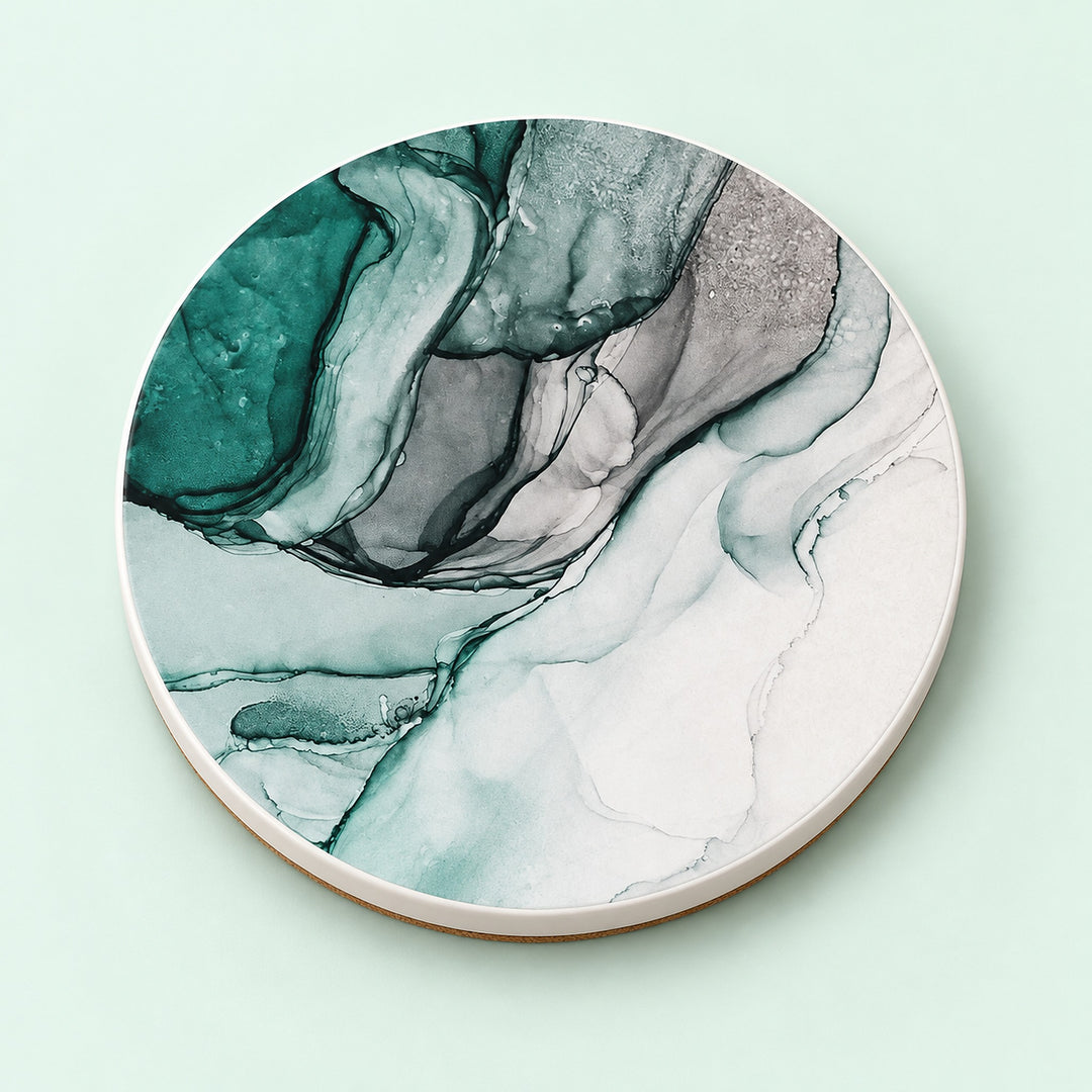 One green and white marble waves printed ceramic coaster on a light studio background.
