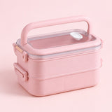 pink double layer plastic bento lunchbox with clear lid and carry handle.