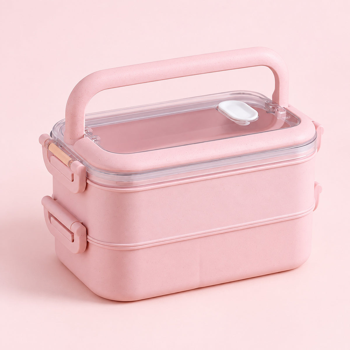 pink double layer plastic bento lunchbox with clear lid and carry handle.