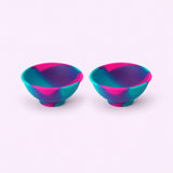Two pink purple and teal swirl silicone mini bowls, open tops and pedestal bases.