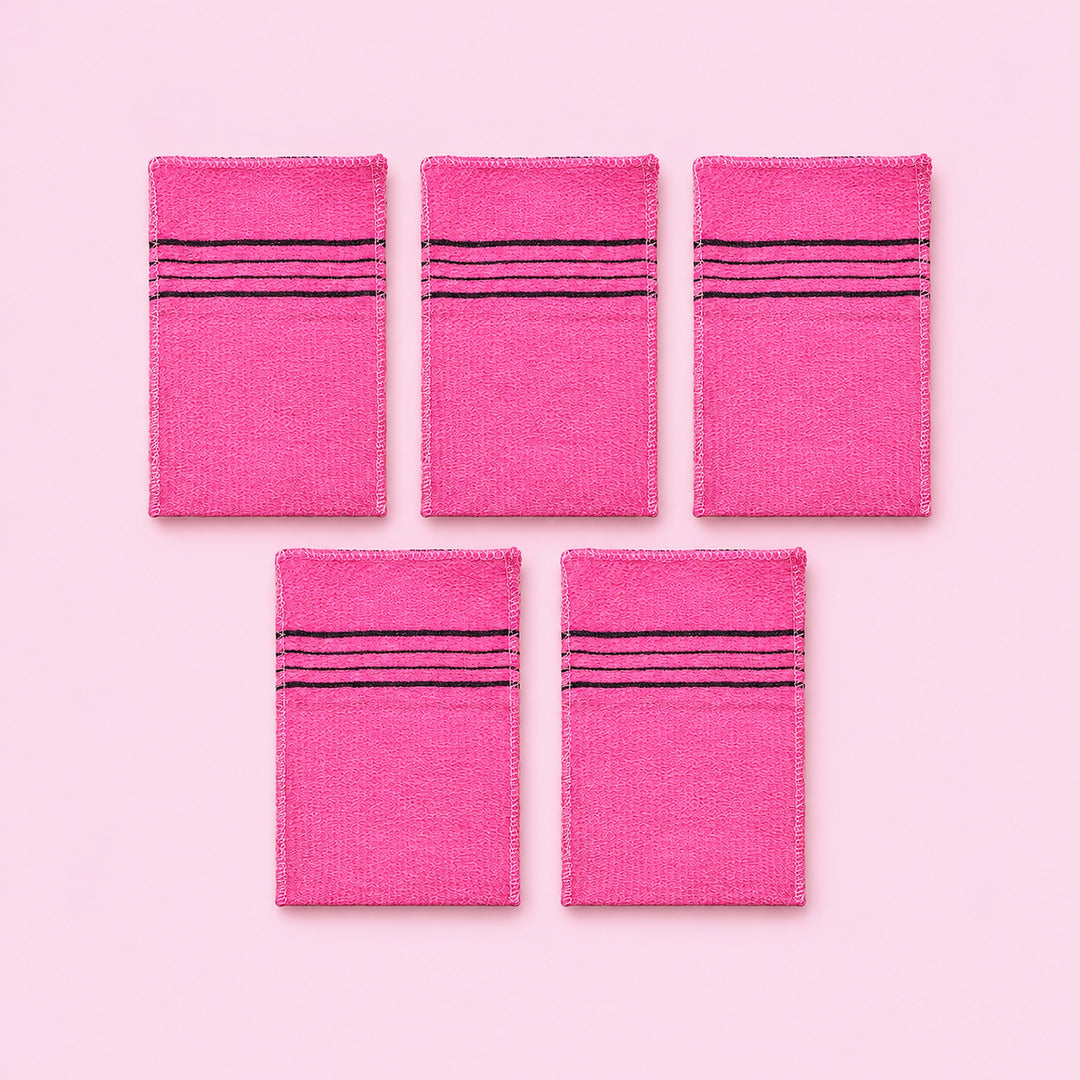 Pink variant: five pink rectangular exfoliating mitts on a lighter pink studio background.