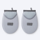 Two rounded garment-steaming pads with mesh hand pockets.
