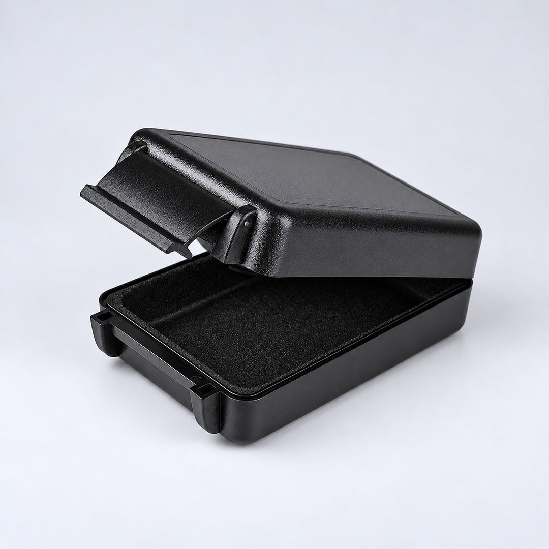 One open solid black rectangular case showing its textured shell and lining.