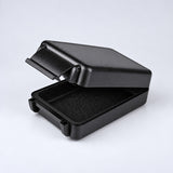 One open solid black rectangular case showing its textured shell and lining.