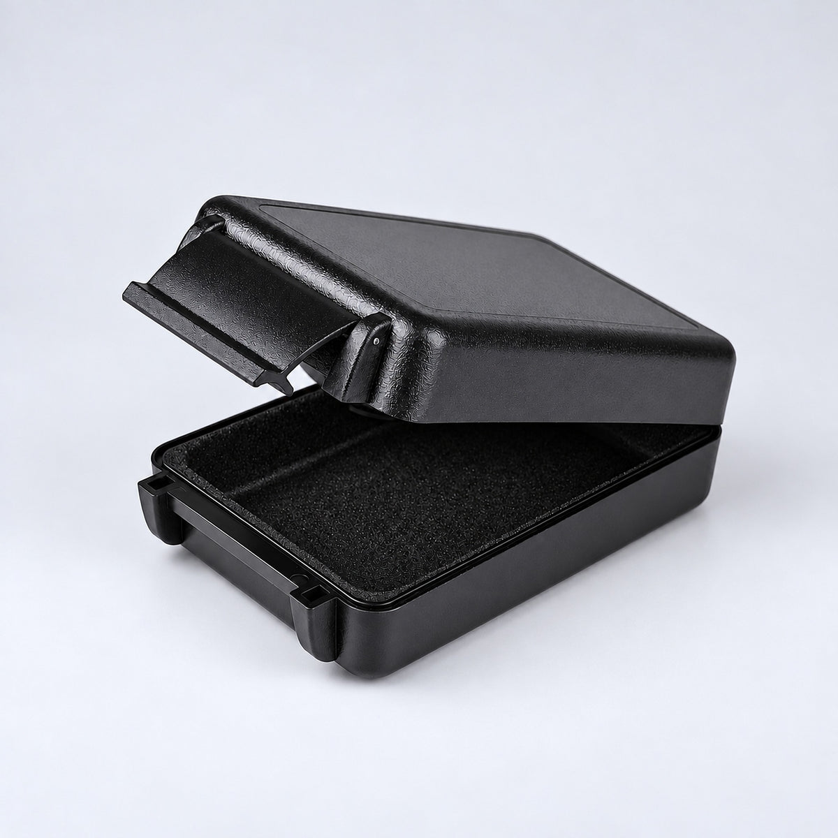 One open solid black rectangular case showing its textured shell and lining.