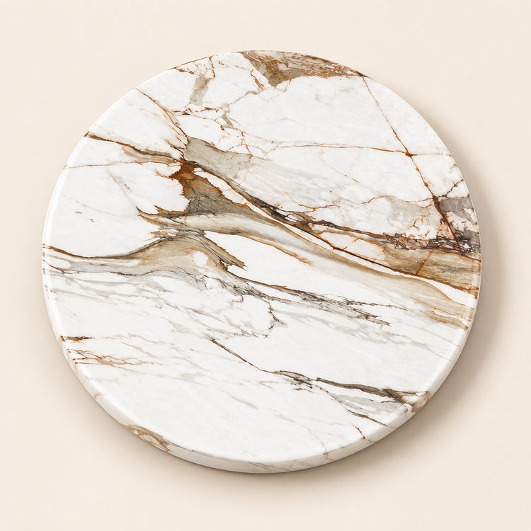 A round coasters or trivets featuring a white marble pattern with elegant brown and gray veining, displayed on a solid beige background.