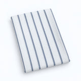 Single white stripes cotton towel, folded studio view.