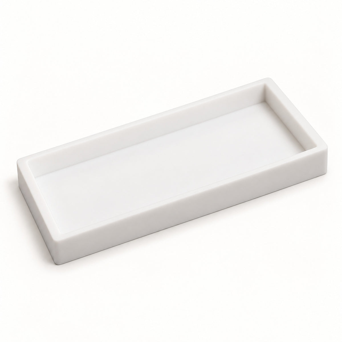 A minimalist white rectangular tray with a shallow, rounded rim, photographed on a seamless white background.