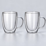 Two empty tall 450 ml clear double-wall glass mugs with handles.
