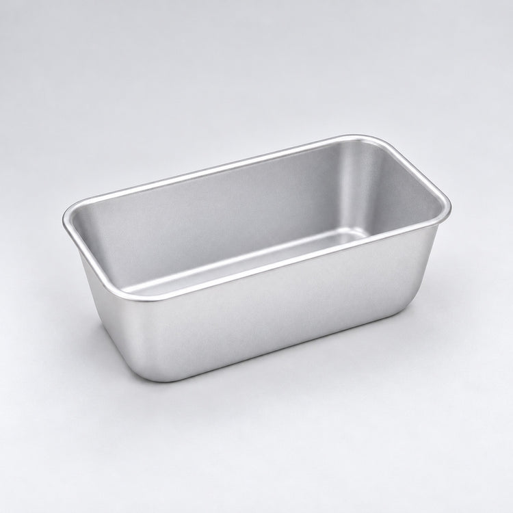 Empty silver aluminum loaf pan, 16.3 x 9.8 x 6.7 cm.