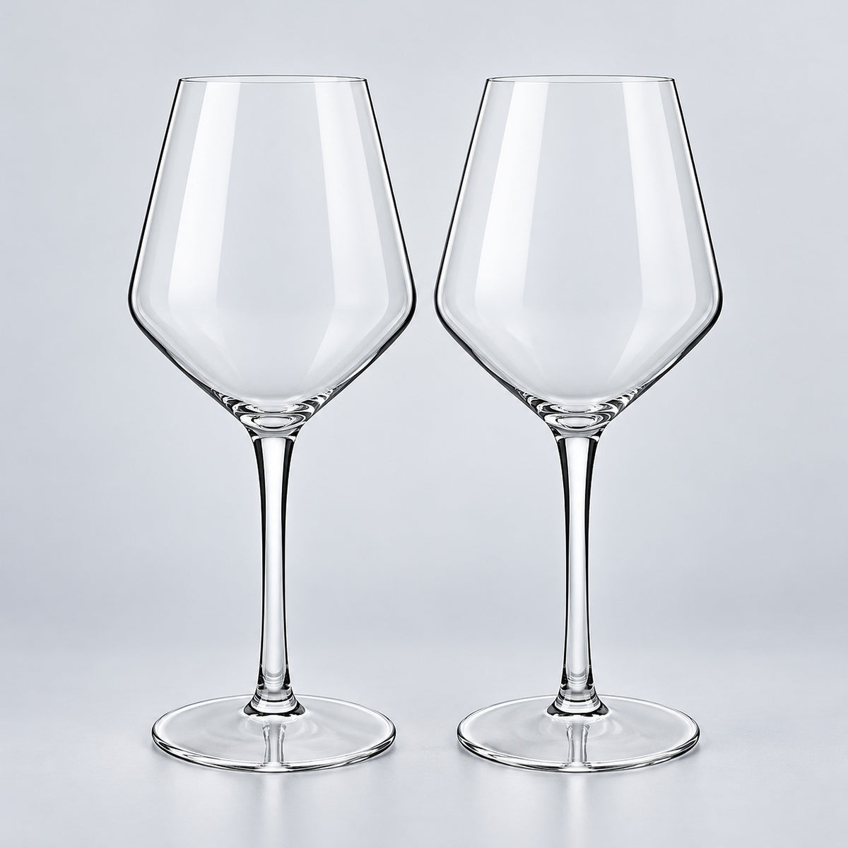 Bordeaux set of 2: 2 empty clear stemmed Tritan wine cups on a pale gray studio background.