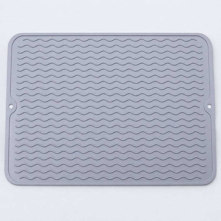 Light gray wavy-ridge silicone mat with two hanging holes.