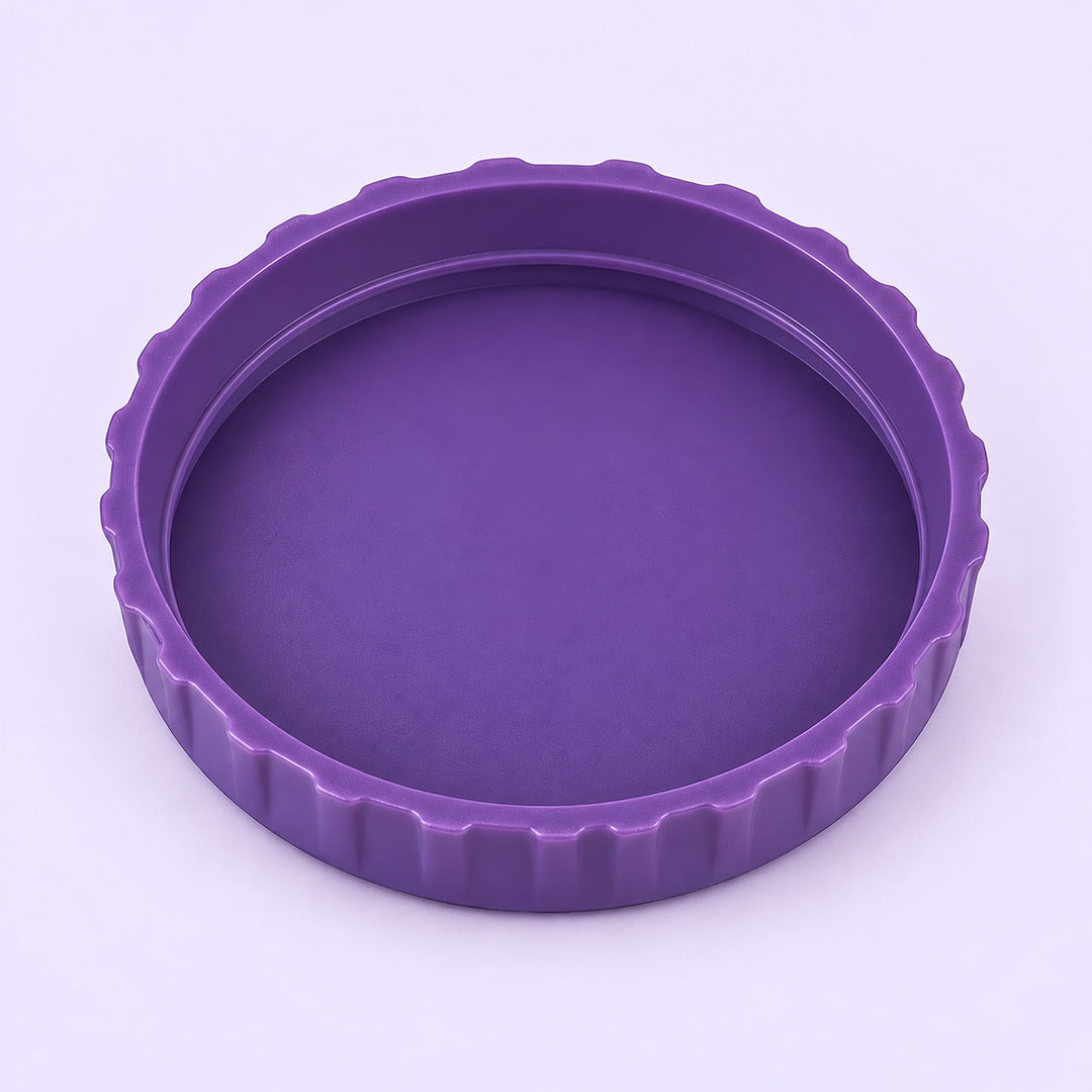 One purple lid, interior-up studio view on pale lavender.