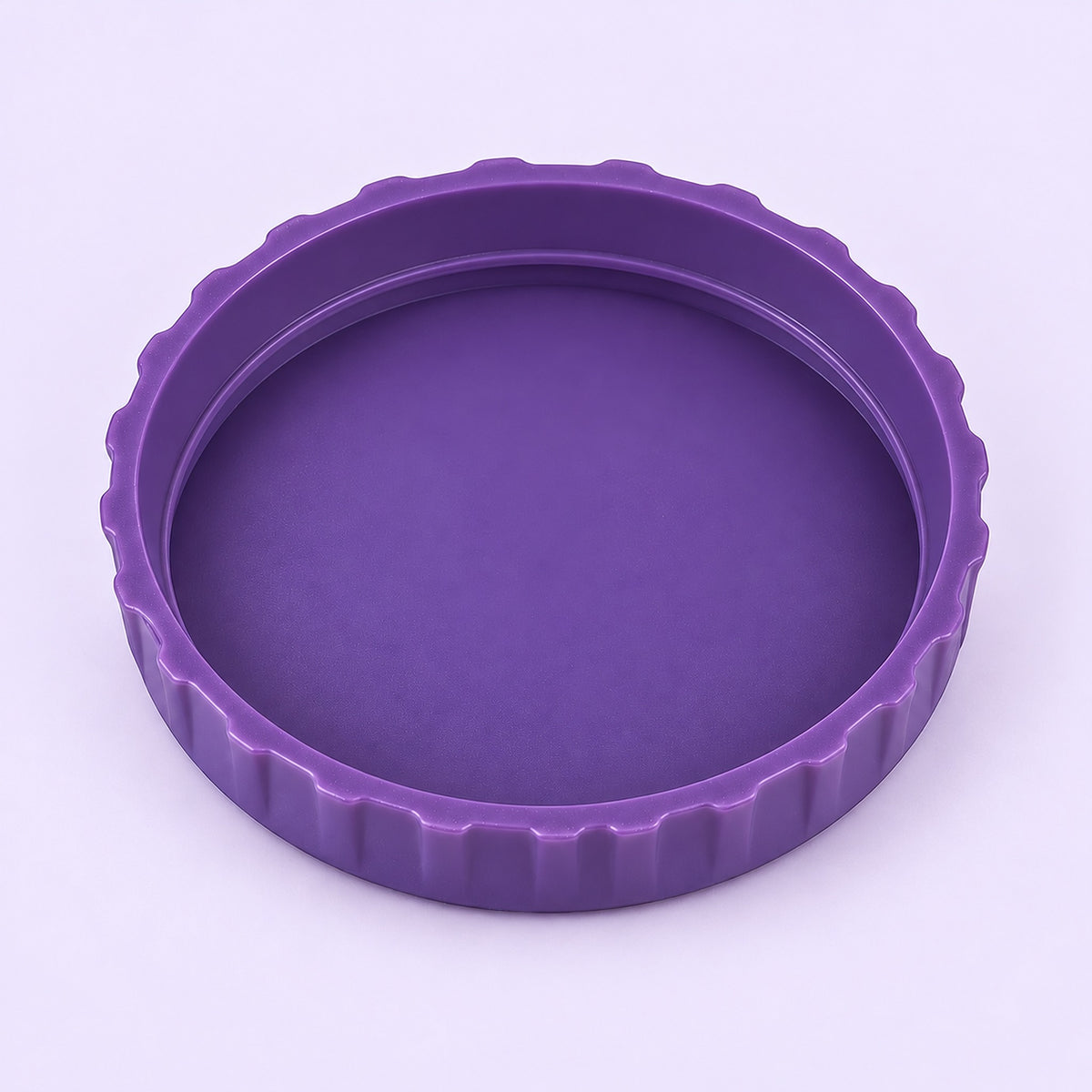 One purple lid, interior-up studio view on pale lavender.