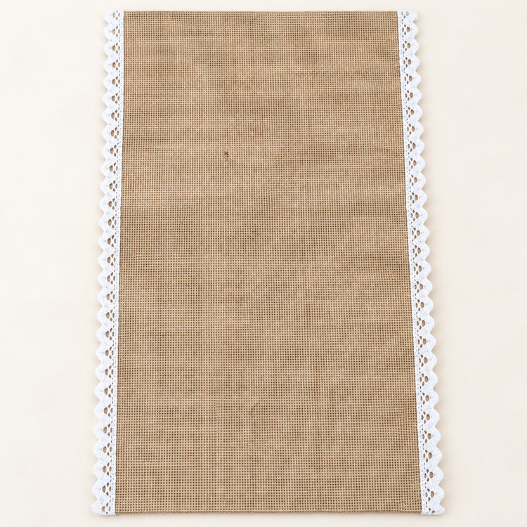 One tan placemat with white scalloped trim, 30 x 45 cm.