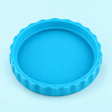 One cyan-blue lid, interior-up studio view on pale cyan.