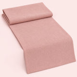 Pink cotton table runner with sewn edges, folded studio view; choose length separately.