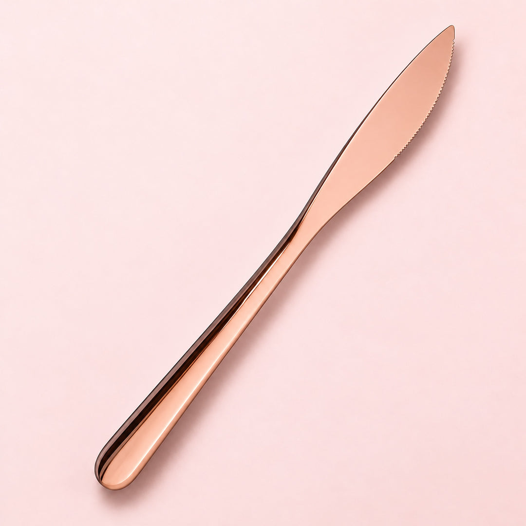 One rose dinner knife on a soft studio background.