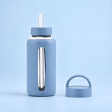 Sky Blue 800 ml glass bottle with silicone sleeve, wide straw and spare loop lid.