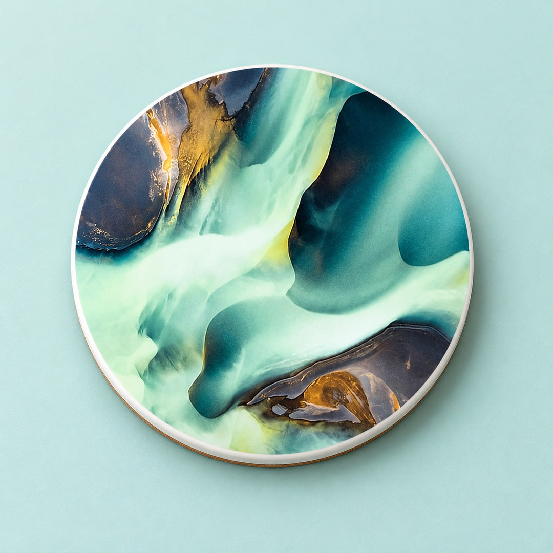 One teal and gold abstract swirls printed ceramic coaster on a light studio background.
