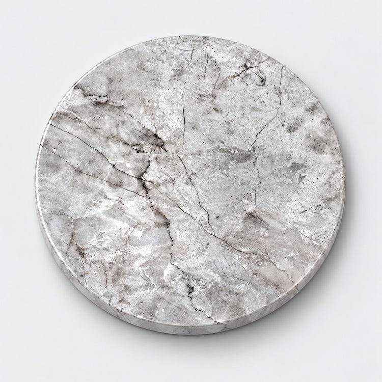 A round marble-patterned coaster or tray with a textured silver-gray surface and dark veining, shown on a light gray background.