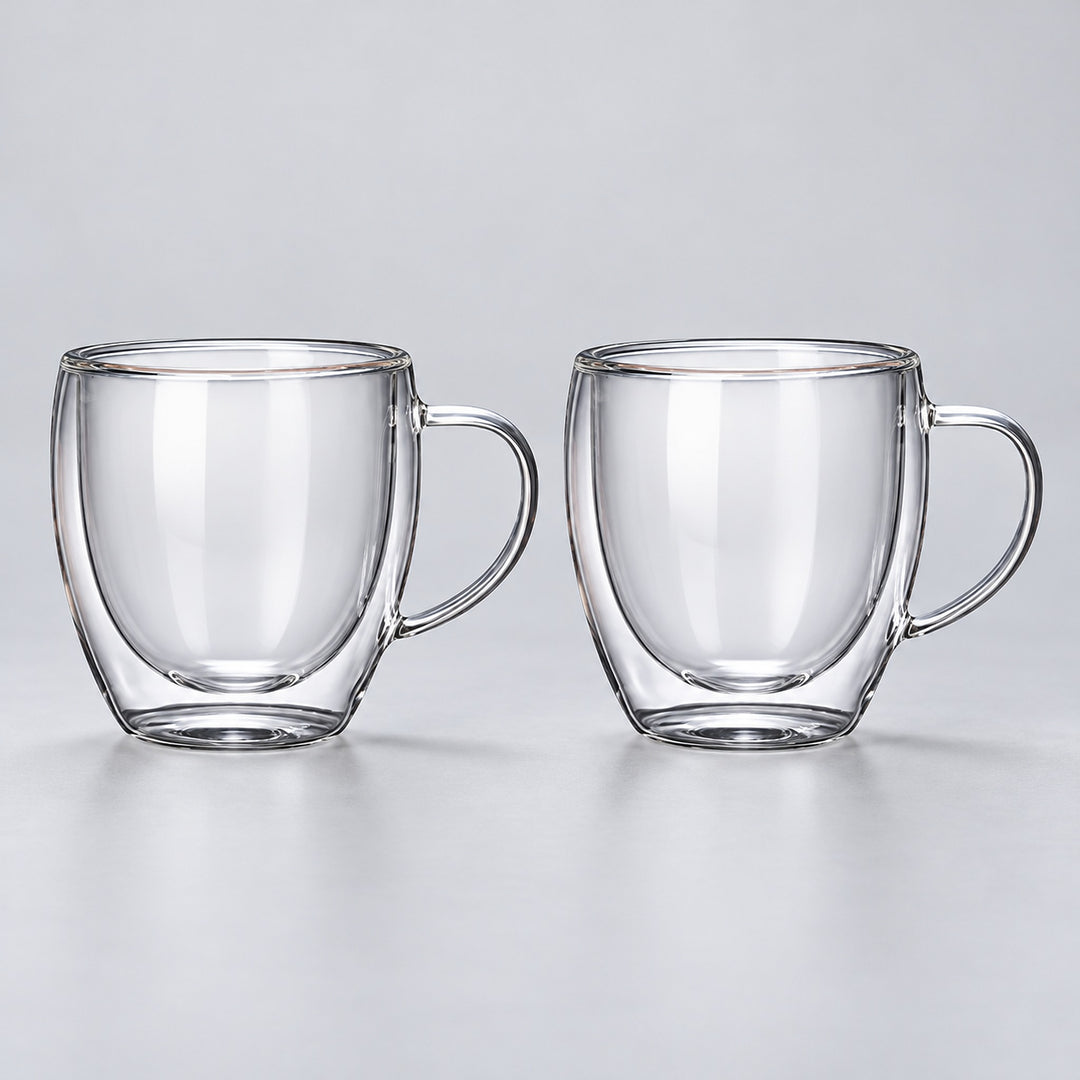 Two empty rounded 250 ml clear double-wall glass mugs with handles.