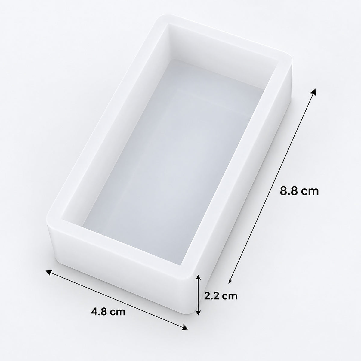 A white rectangular mold or tray with dimension arrows and labels showing 8.8 cm length, 4.