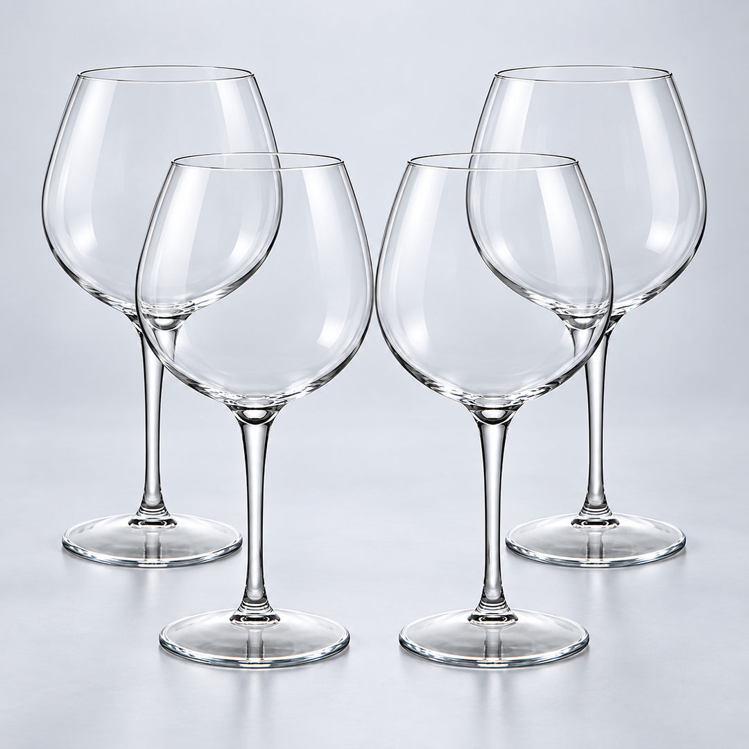 Burgundy set of 4: 4 empty clear stemmed Tritan wine cups on a pale gray studio background.