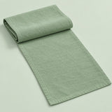 Light Green cotton table runner with sewn edges, folded studio view; choose length separately.