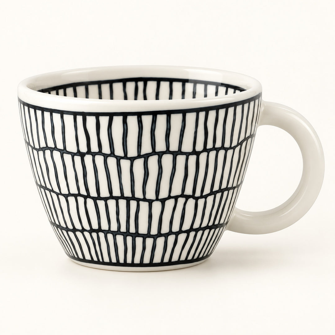 A white ceramic coffee mug with a black hand-drawn vertical stripe pattern, shown on a clean white background.