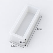 A white rectangular mold or tray with dimension annotations showing 6.8 cm height, 2.