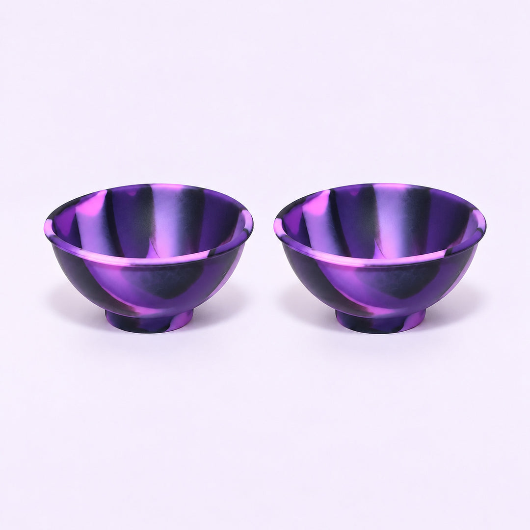 Two black and purple swirl silicone mini bowls, open tops and pedestal bases.